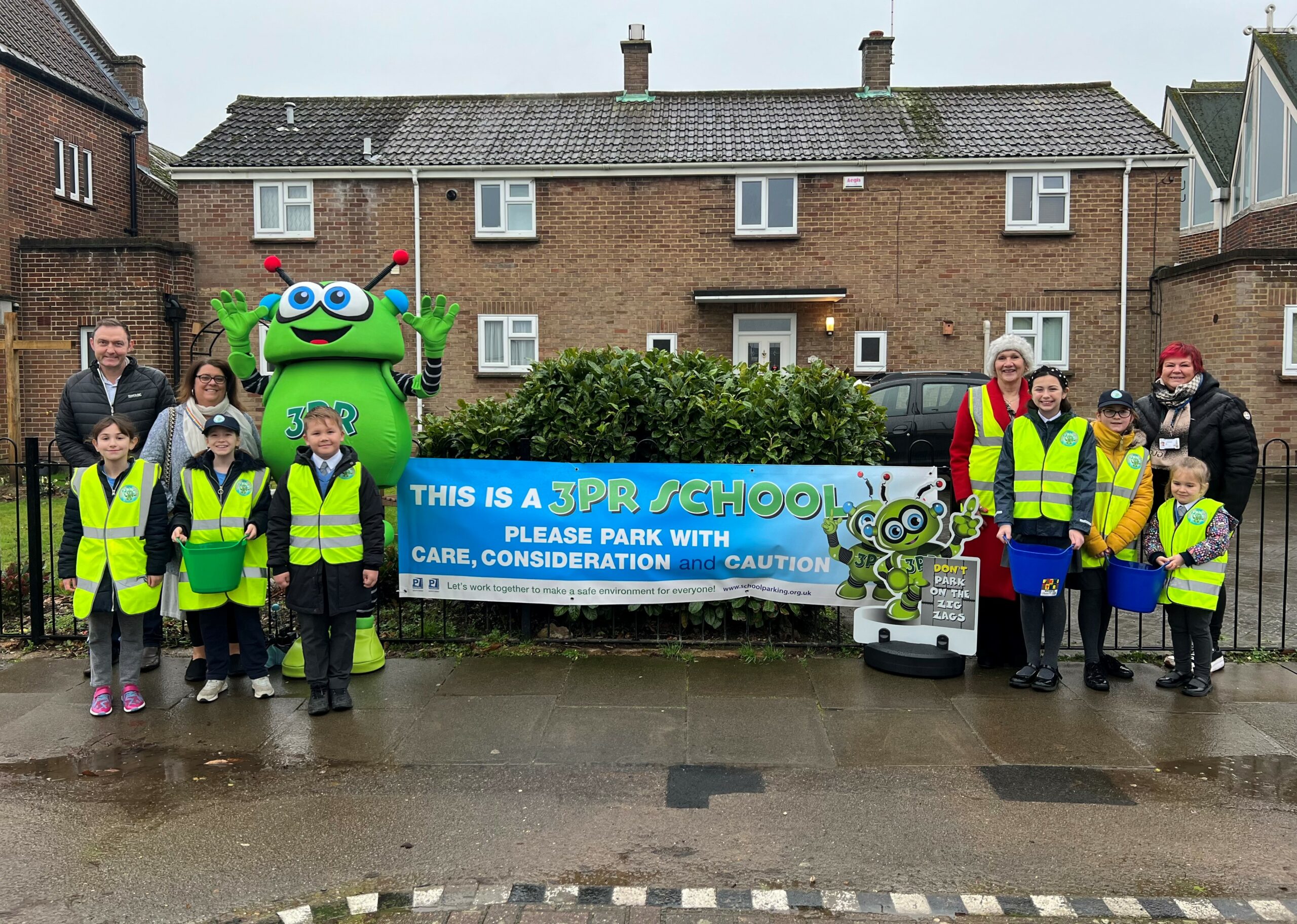Photo of 3PR launch at St Teresa’s Catholic Primary School in Colchester on 10 January 2023: (Not in order) Councillor Martin Goss (NEPP’s Member for Colchester City Council), Ward Councillors Sue Lissimore and Leigh Tate, Mrs Kelly (Headteacher of St Teresa’s Catholic Primary School), school pupils and the 3PR costumed-character.